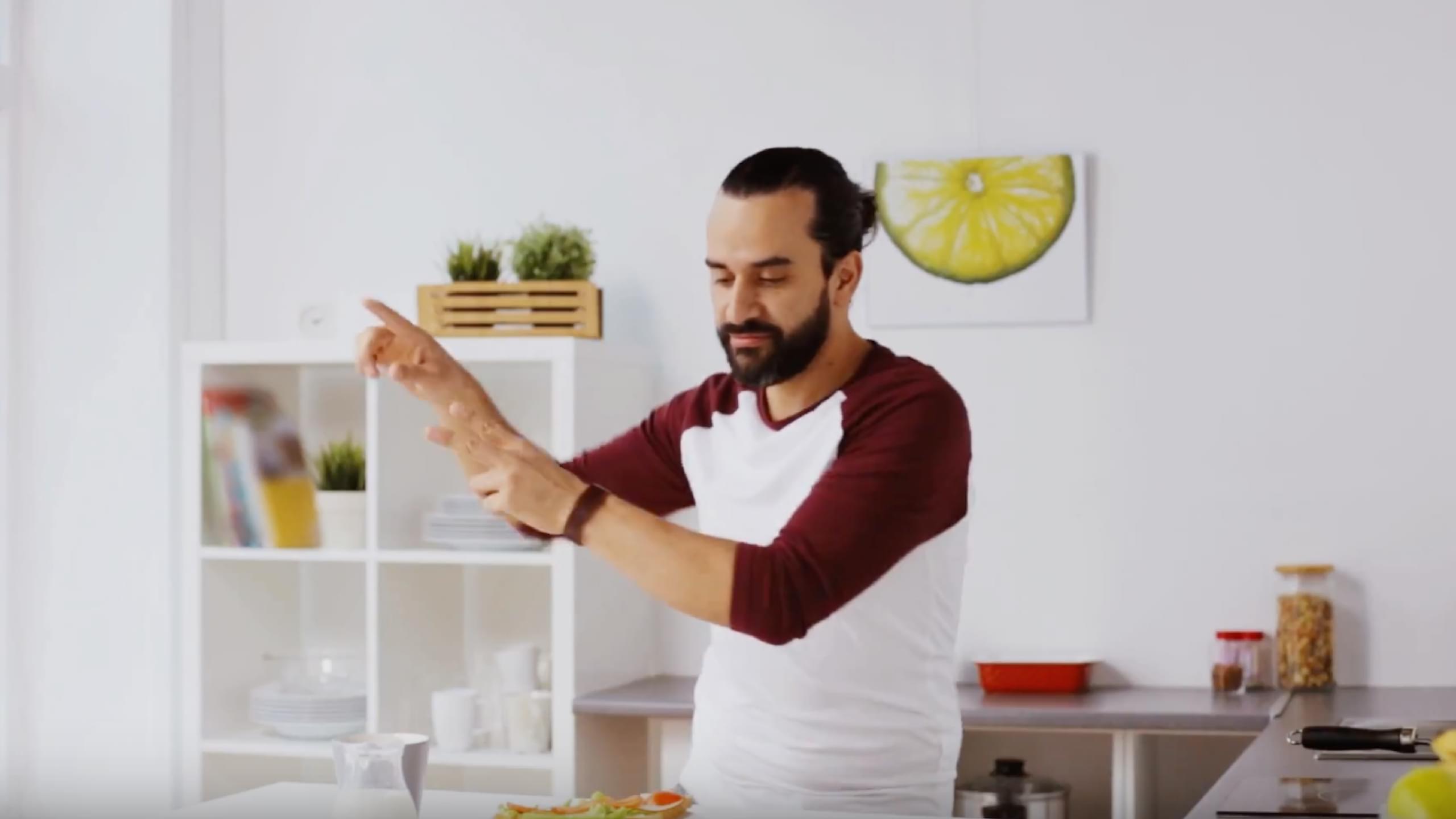 video preview of a man dancing in their kitchen
