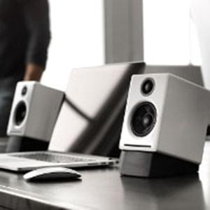 White Speaker and a laptop in an office